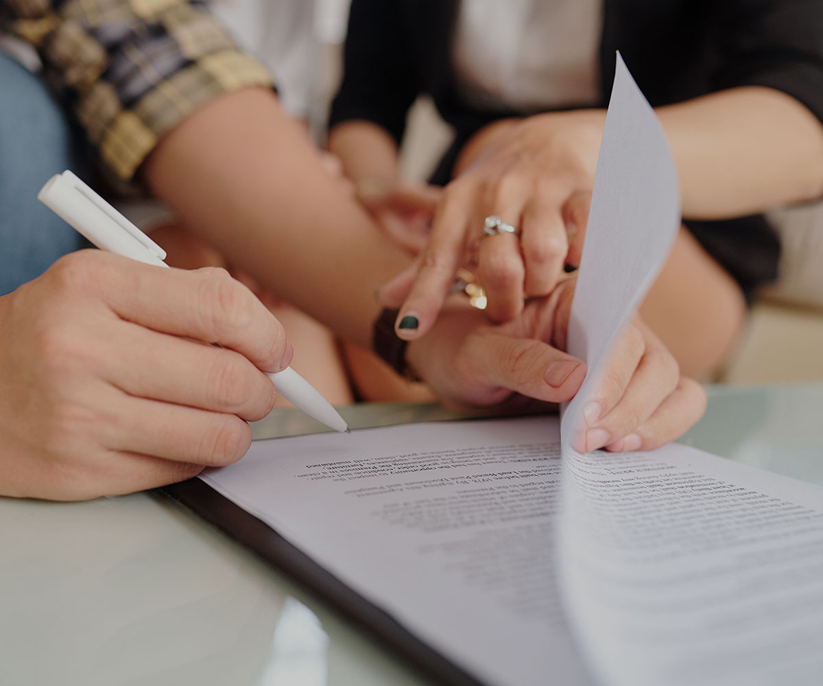 image of people signing a gestational contract